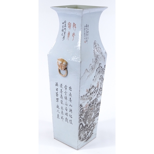 66 - A Chinese porcelain square section vase with painted mountain landscape and text, height 57cm, rim d... 