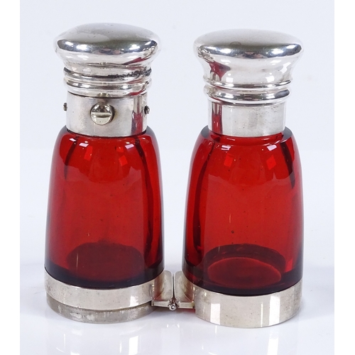 76 - A Victorian Cranberry glass and unmarked white metal-mounted double-ended perfume bottle, with hinge... 