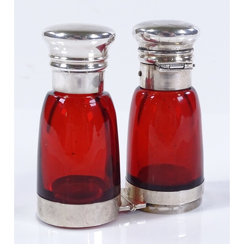 76 - A Victorian Cranberry glass and unmarked white metal-mounted double-ended perfume bottle, with hinge... 