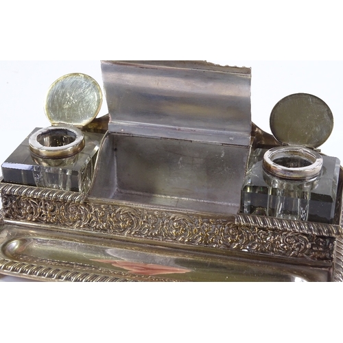 81 - A Victorian electroplate desk stand, with original cut-glass inkwells and cast mounts, width 20cm