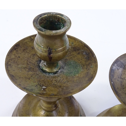 85 - A set of bronze candle stands, height 14cm