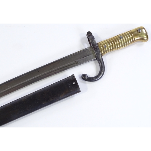 91 - A 19th century French sword bayonet, with brass hilt and original metal scabbard, dated 1872, blade ... 