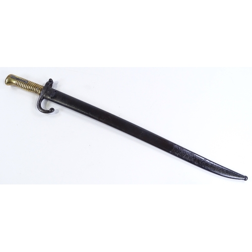 91 - A 19th century French sword bayonet, with brass hilt and original metal scabbard, dated 1872, blade ... 