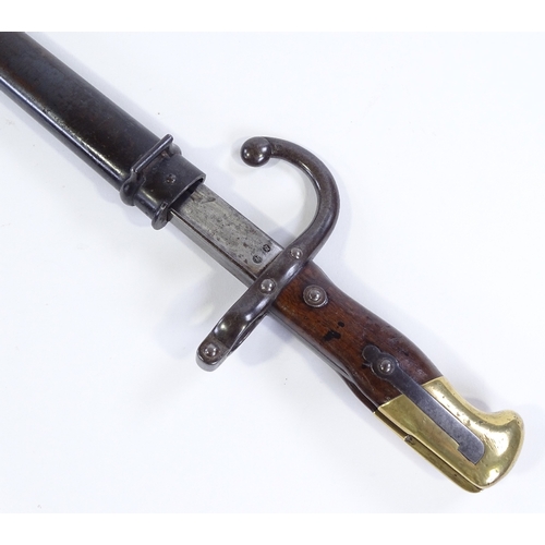 92 - A 19th century French sword bayonet, brass-mounted hilt with original metal scabbard, dated 1877, bl... 