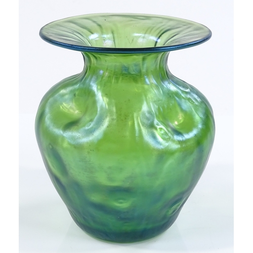 98 - A Loetz green iridescent glass dimpled vase, height 11cm