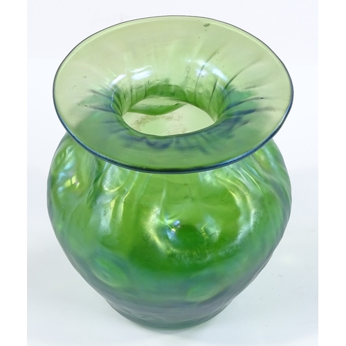 98 - A Loetz green iridescent glass dimpled vase, height 11cm