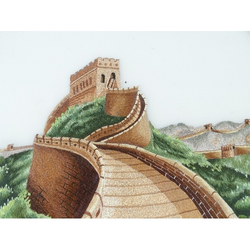 1285 - A Chinese double-sided silk embroidered picture, depicting The Great Wall of China, diameter 14