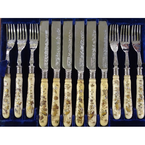 200 - A superb quality set of mid-19th century ivory Shibayama-handled dessert knives and forks for 12 peo... 