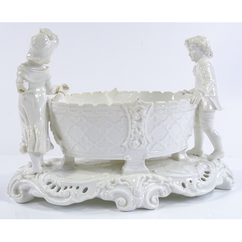 201 - A Victorian Moore Brothers ceramic table centre basket, flanked by 2 children figures, length 29cm, ... 