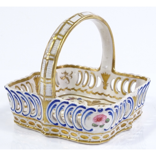 202 - A small 19th century Derby porcelain basket, with painted and gilded decoration, 10cm across