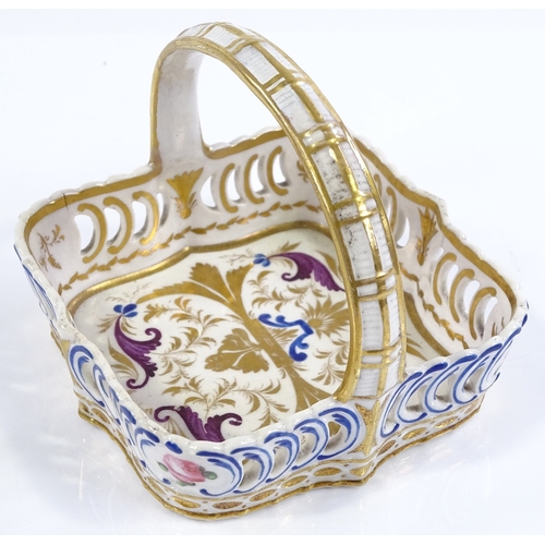 202 - A small 19th century Derby porcelain basket, with painted and gilded decoration, 10cm across