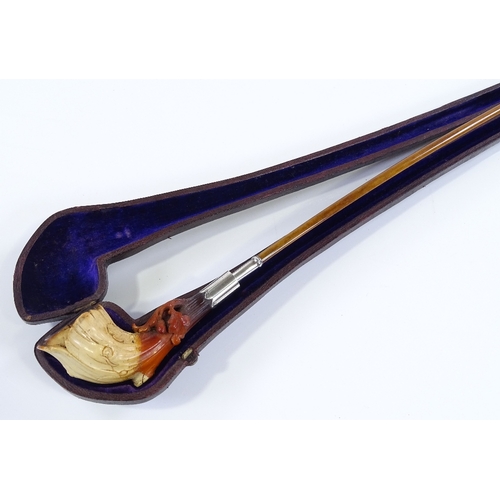 208 - A 19th century silver-mounted carved Meerschaum pipe, length 43cm, in original leather case