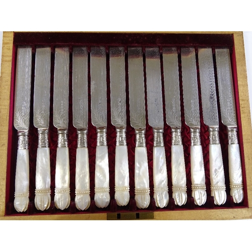 211 - A cased set of Victorian carved mother-of-pearl handled dessert knives and forks for 12 people (miss... 