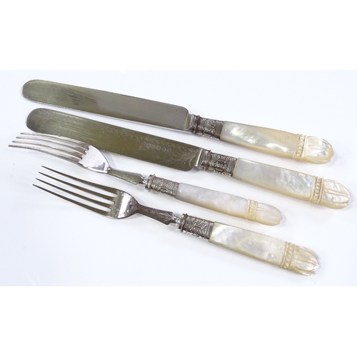 211 - A cased set of Victorian carved mother-of-pearl handled dessert knives and forks for 12 people (miss... 