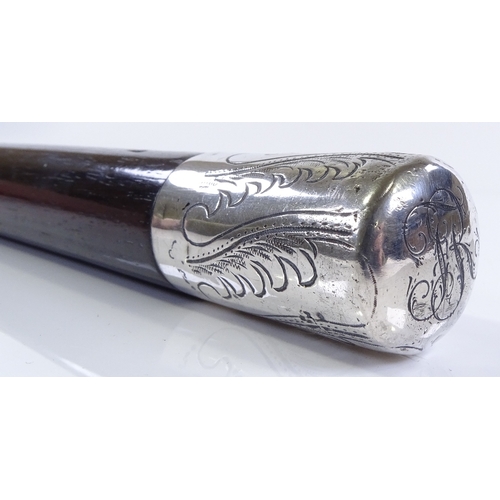 214 - A 19th century unmarked silver-topped snake wood walking stick