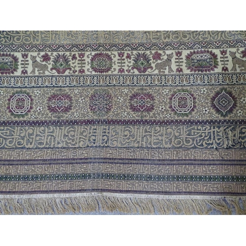 216 - A large Islamic embroidered wall hanging with lines of text, 225cm x 190cm