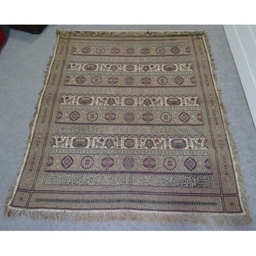 216 - A large Islamic embroidered wall hanging with lines of text, 225cm x 190cm