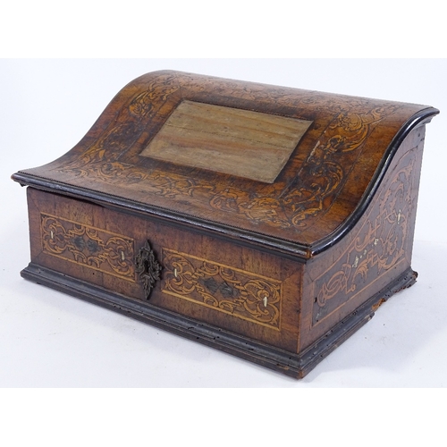 217 - An 18th century Dutch marquetry and walnut desktop box, with serpentine-shaped lid and boxwood and i... 