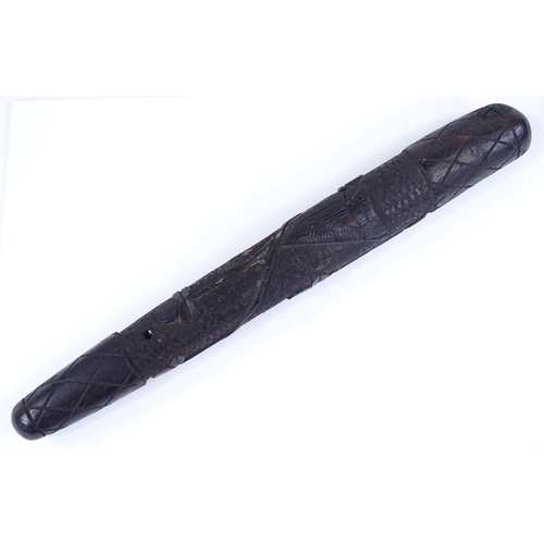 226 - An Irish relief carved bog oak club, length 42cm