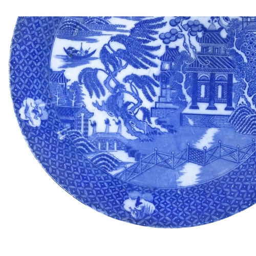 227 - A pair of Chinese blue and white transfer decorated chargers, diameter 40cm