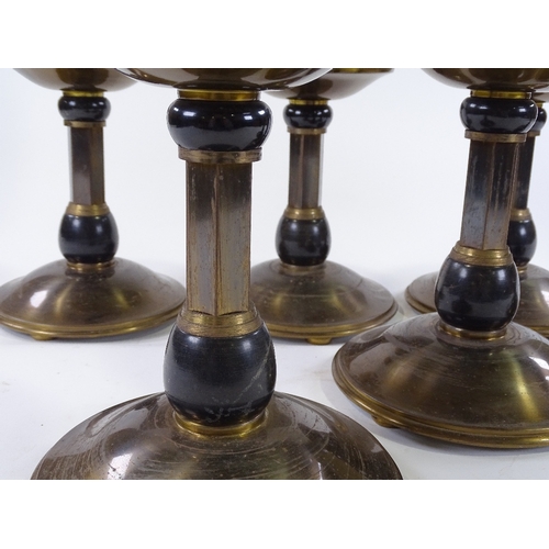 47 - A set of 6 Art Deco patinated brass pricket candle stands, height 25cm