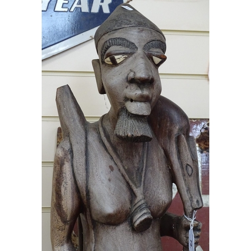 55 - A large carved hardwood African figure, height 40