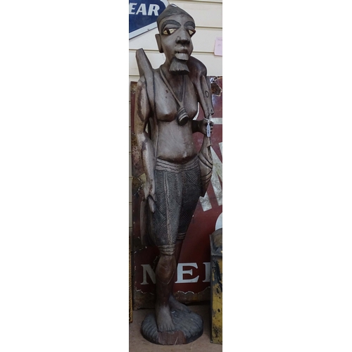 55 - A large carved hardwood African figure, height 40