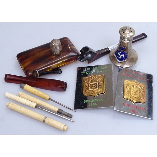 101 - A mixed box of items, including a 1960s British Coach Rally car badges, Bakelite cigarette holders e... 