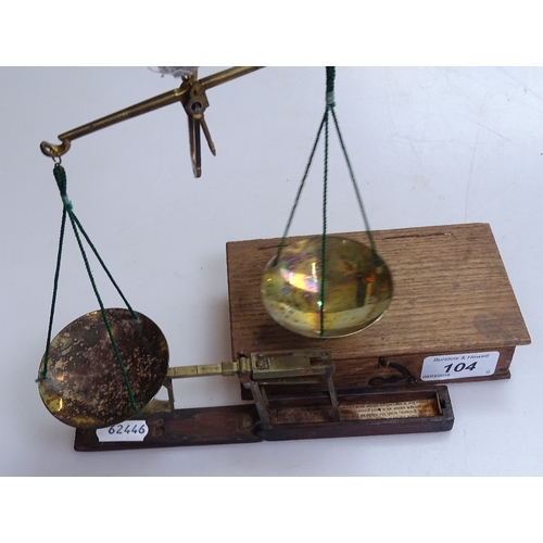 104 - Victorian brass and mahogany travelling sovereign scales, and a cased set of brass Apothecary scales... 