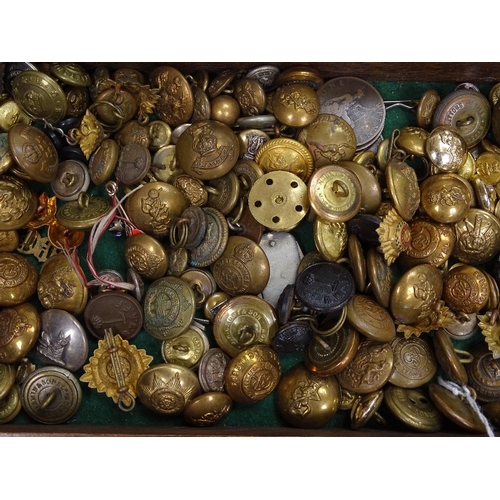 108 - A collection of victorian and later military badges and buttons.