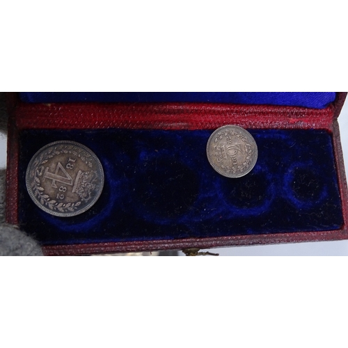 110 - An 1882 Maundy coin case containing 2 coins, various other commemorative crowns and coins