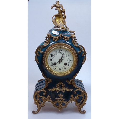 12 - A 19th century French blue-glaze ceramic-cased mantel clock, with ornate gilt-metal mounts, ornate e... 