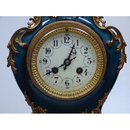 12 - A 19th century French blue-glaze ceramic-cased mantel clock, with ornate gilt-metal mounts, ornate e... 