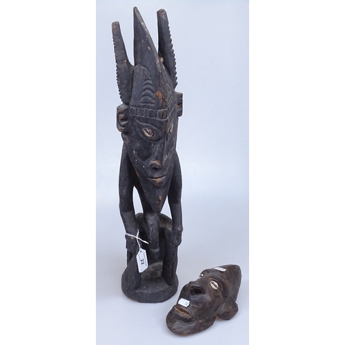 22 - An African Tribal seated figure, height 22