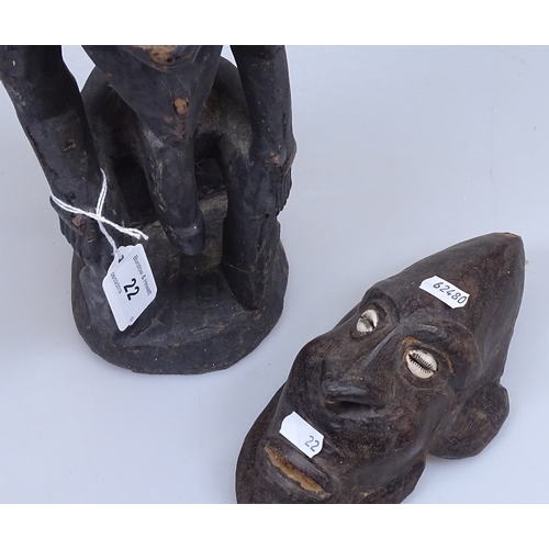 22 - An African Tribal seated figure, height 22