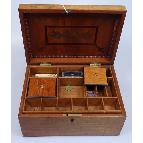 24 - A 19th century carved mahogany workbox, with fitted interior and contents