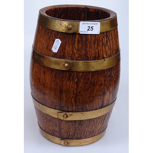 25 - A small ornamental brass-bound oak barrel, height 10