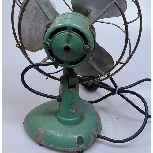 67 - A Vintage Frost green-enamelled electric fan, height 14