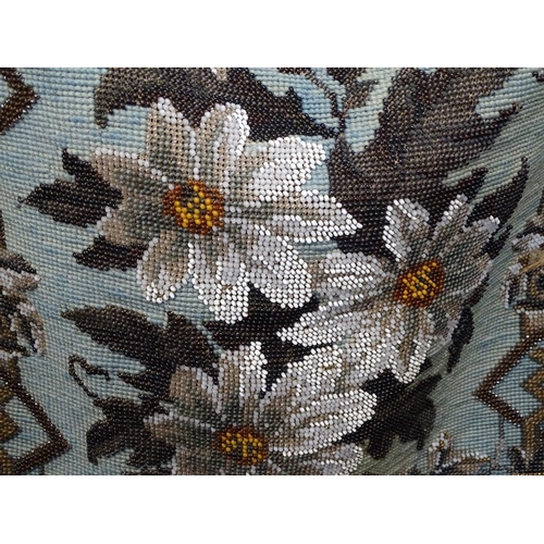 78 - A Victorian beadwork embroidered screen with tassel edge, overall height 23