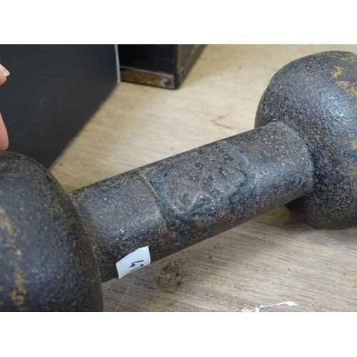 80 - A pair of Victorian cast-iron dumbbells with impressed maker's marks, length 7.5