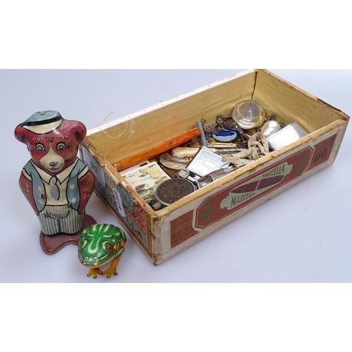 90 - A mixed box of items, including tinplate clockwork bear and frog, desk items, pocket lighters, penkn... 