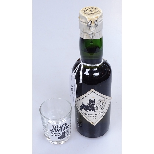 99 - A half bottle of Black and White special blend of Buchanan's Choice Old Scotch Whisky, and a small W... 