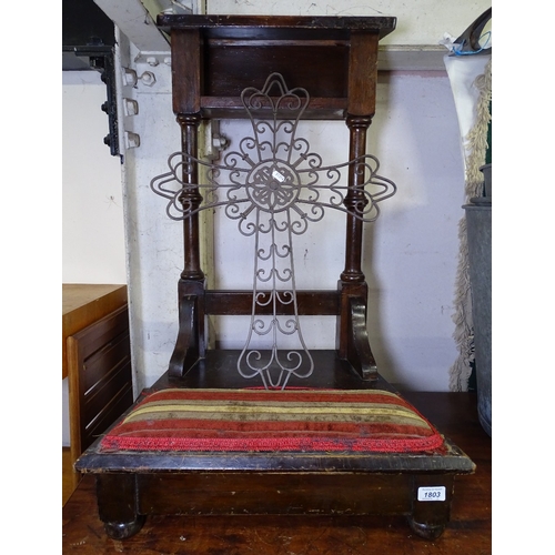 1803 - A Gothic oak prayer stand, and a pierced metal cross