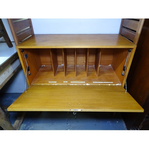 1804 - A mid-century Staples Ladderax teak shelving unit, with drawer and cupboard, W90cm, H130cm