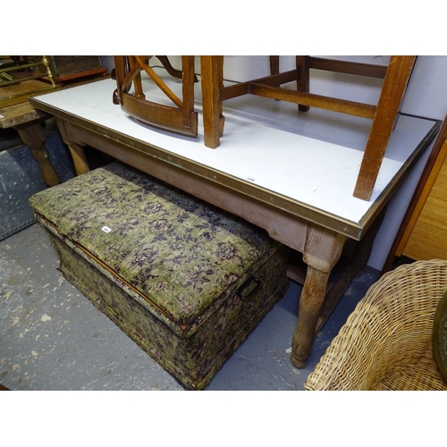 1808 - A rectangular kitchen table with a brass-bound top, on pine base, L156cm