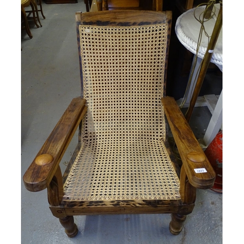 1823 - A hardwood and cane panelled plantation chair