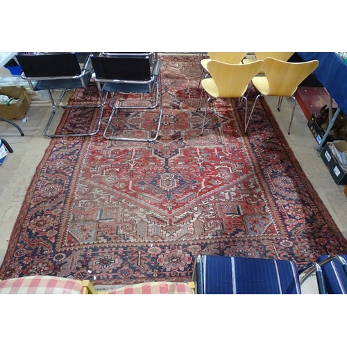 1830 - A large red ground Afghan design carpet, L360cm x W240cm