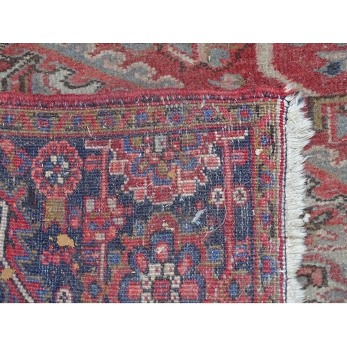 1830 - A large red ground Afghan design carpet, L360cm x W240cm