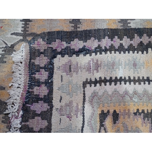 1831 - A long cream ground Kilim runner, with symmetrical brown border, 11'9