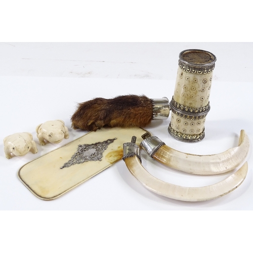 100 - A silver-mounted otter's foot, 2 silver-mounted wild boar tusks, a bone spill vase etc